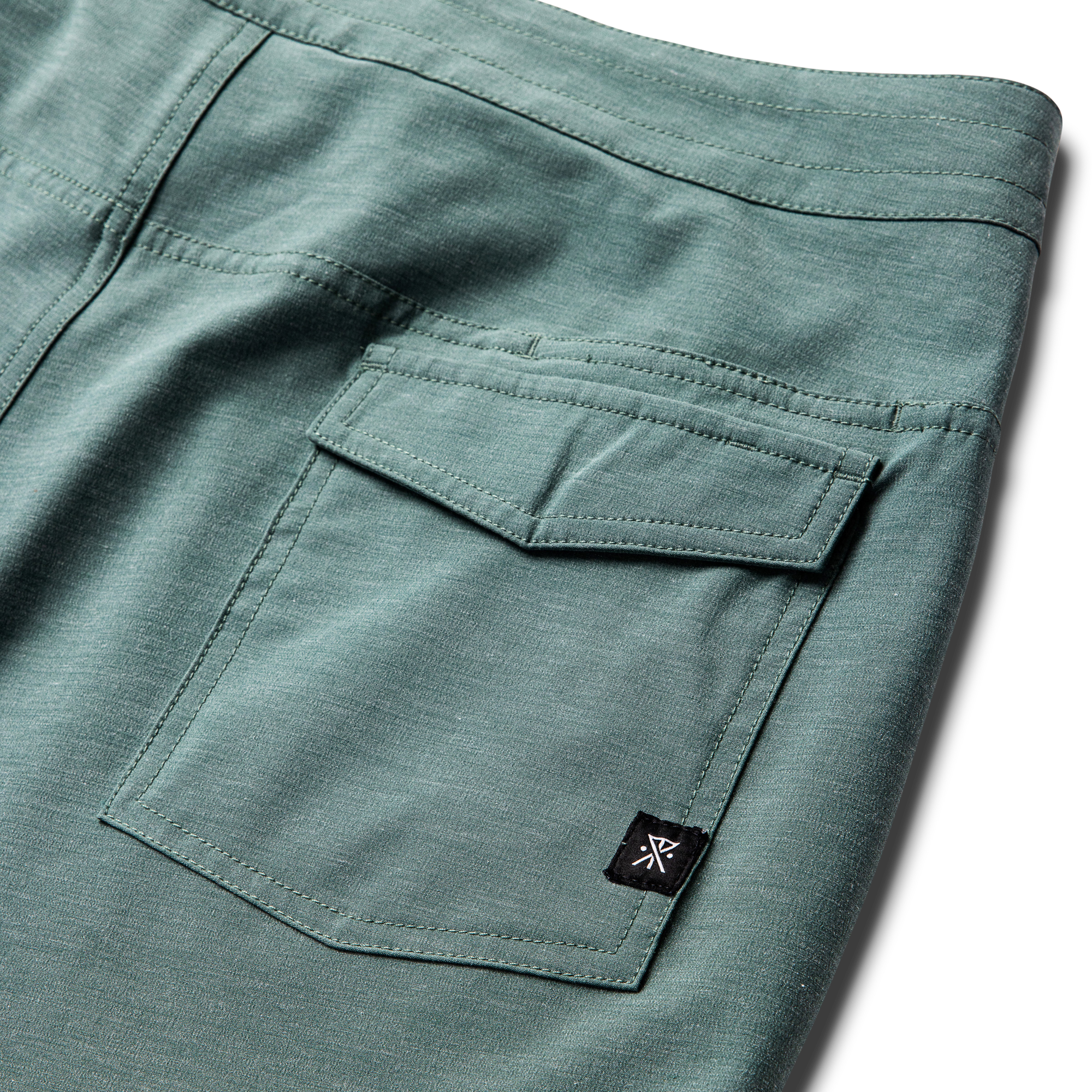 Roark adventure-ready boardshorts displayed against a rugged outdoor backdrop, perfect for surfing or exploration.