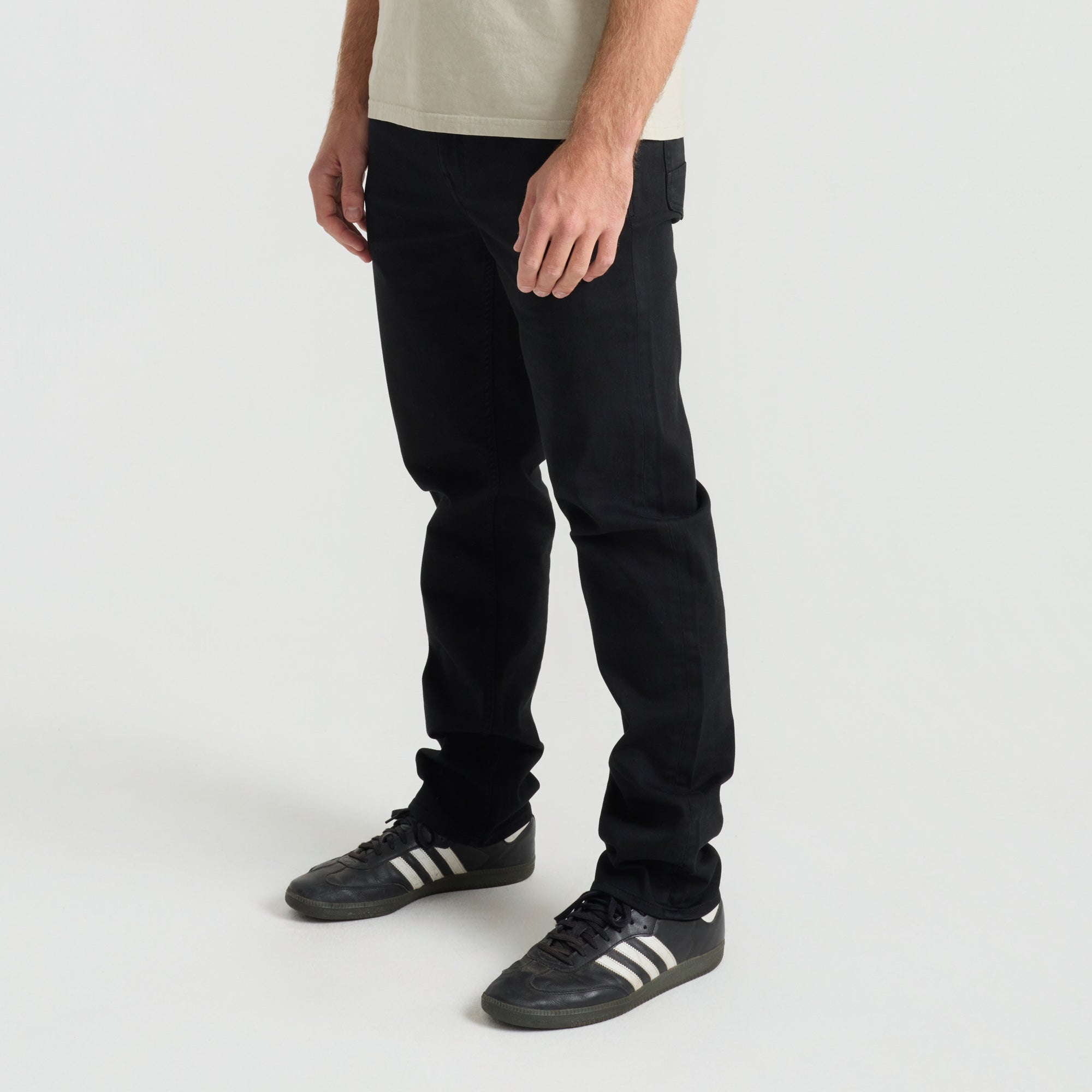 Close-up of a black denim pocket from Roark, emphasizing rugged detail and durability perfect for adventure and travel.
