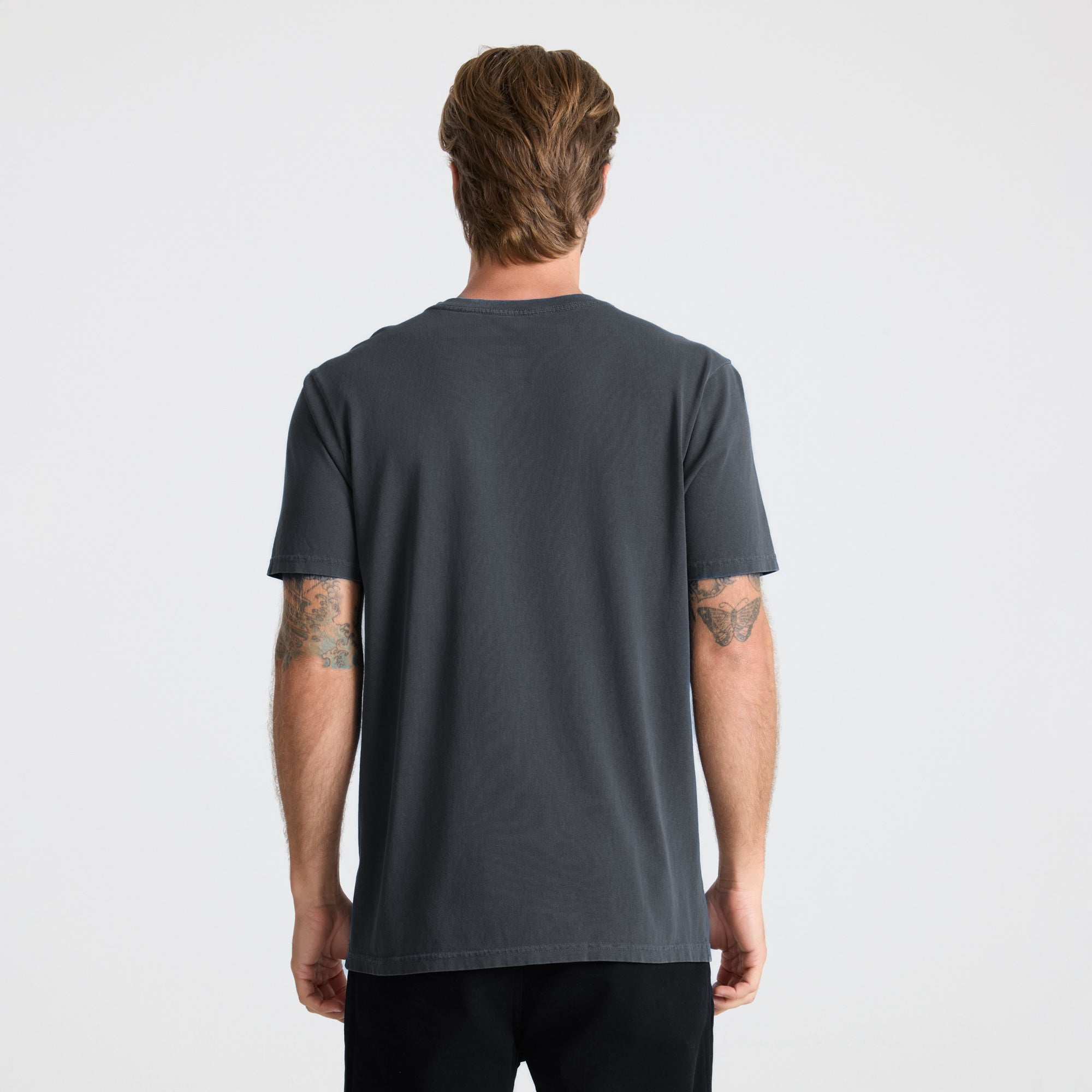 Grey active shirt designed for adventure and outdoor activities by Roark, showcasing durability and comfort for travel enthusiasts.